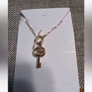 gucci charm/zipper pull repurposed to necklace